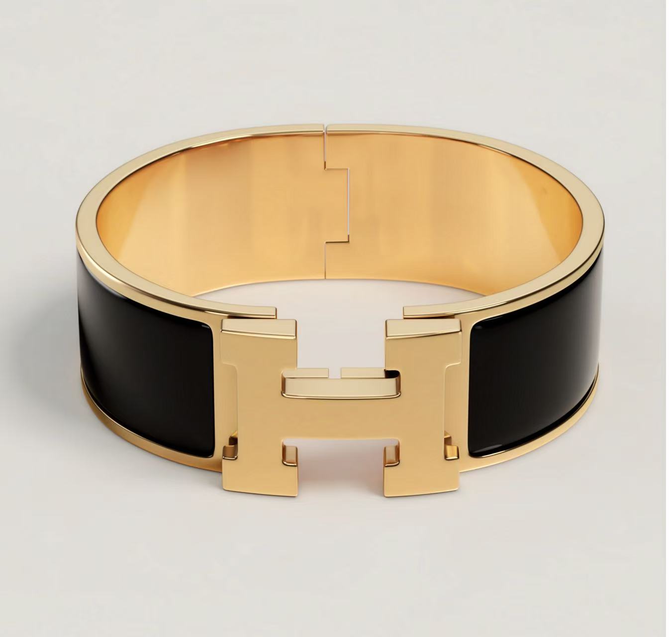 HERMÈS CLIC CLAC H BRACELET BLACK YELLOW GOLD