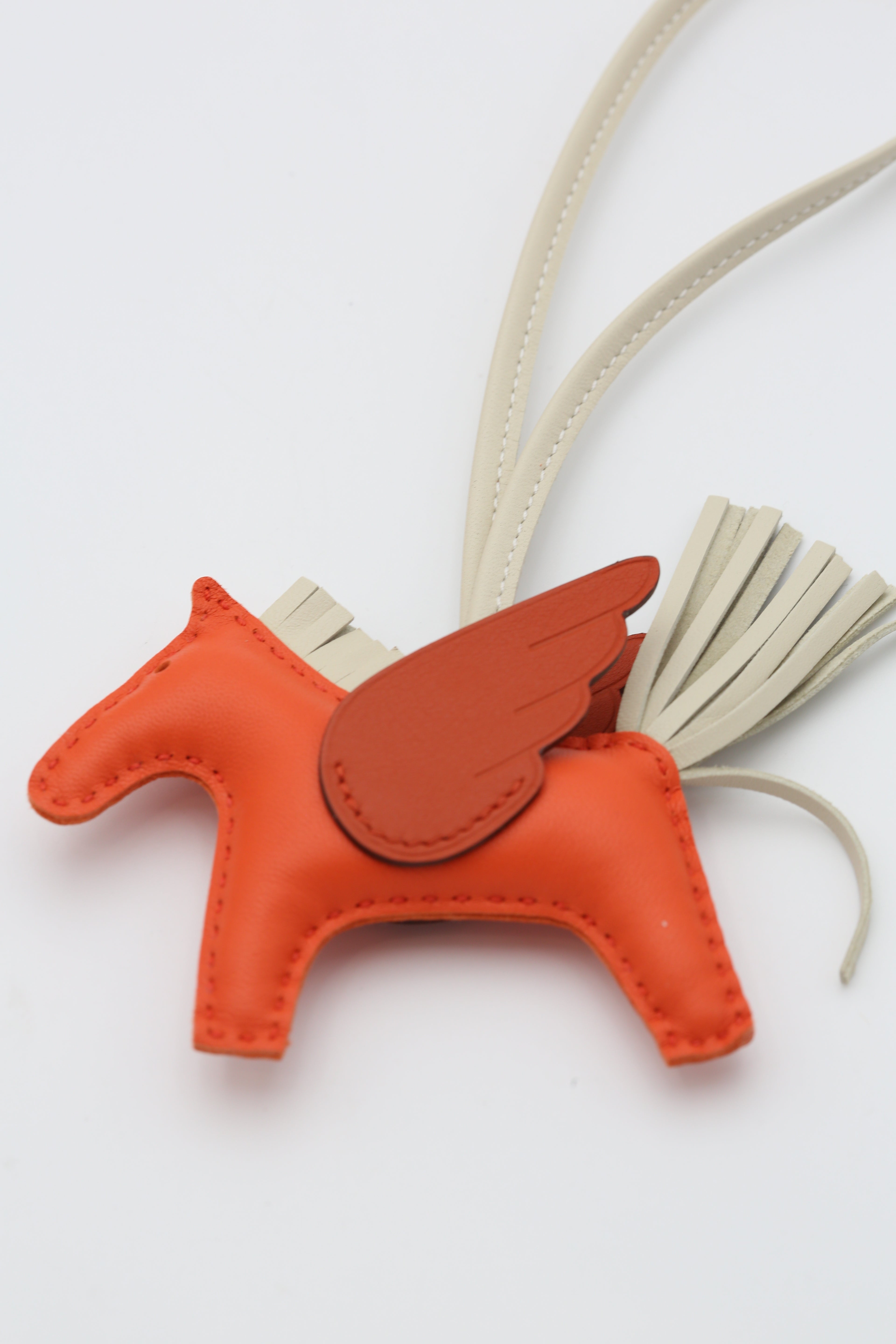 HERMÈS RODEO PEGASE PM CHARM ORANGE/GOLD/CRAIE