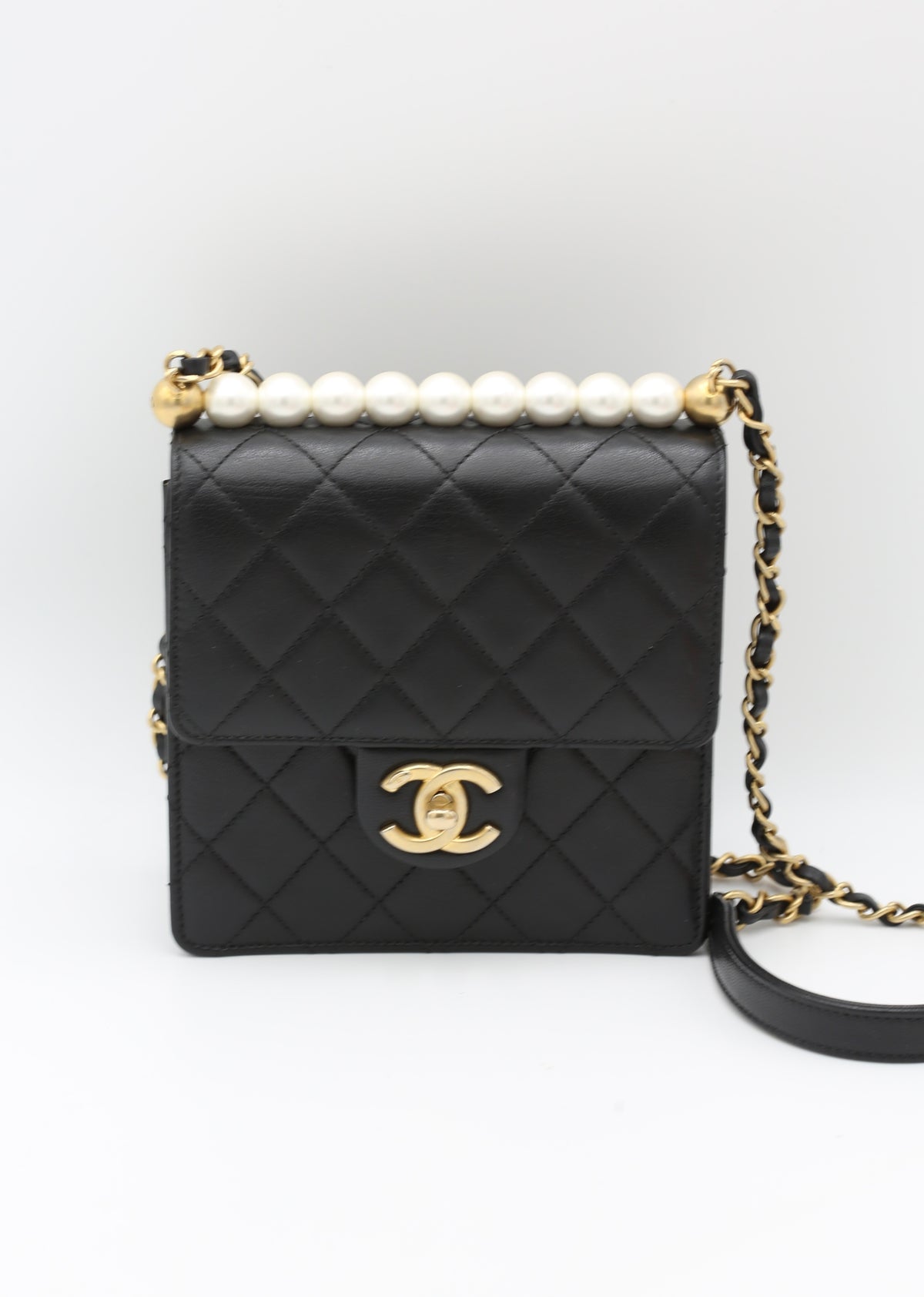 CHANEL BLACK QUILTED MINI BAG WITH PEARL HANDLE