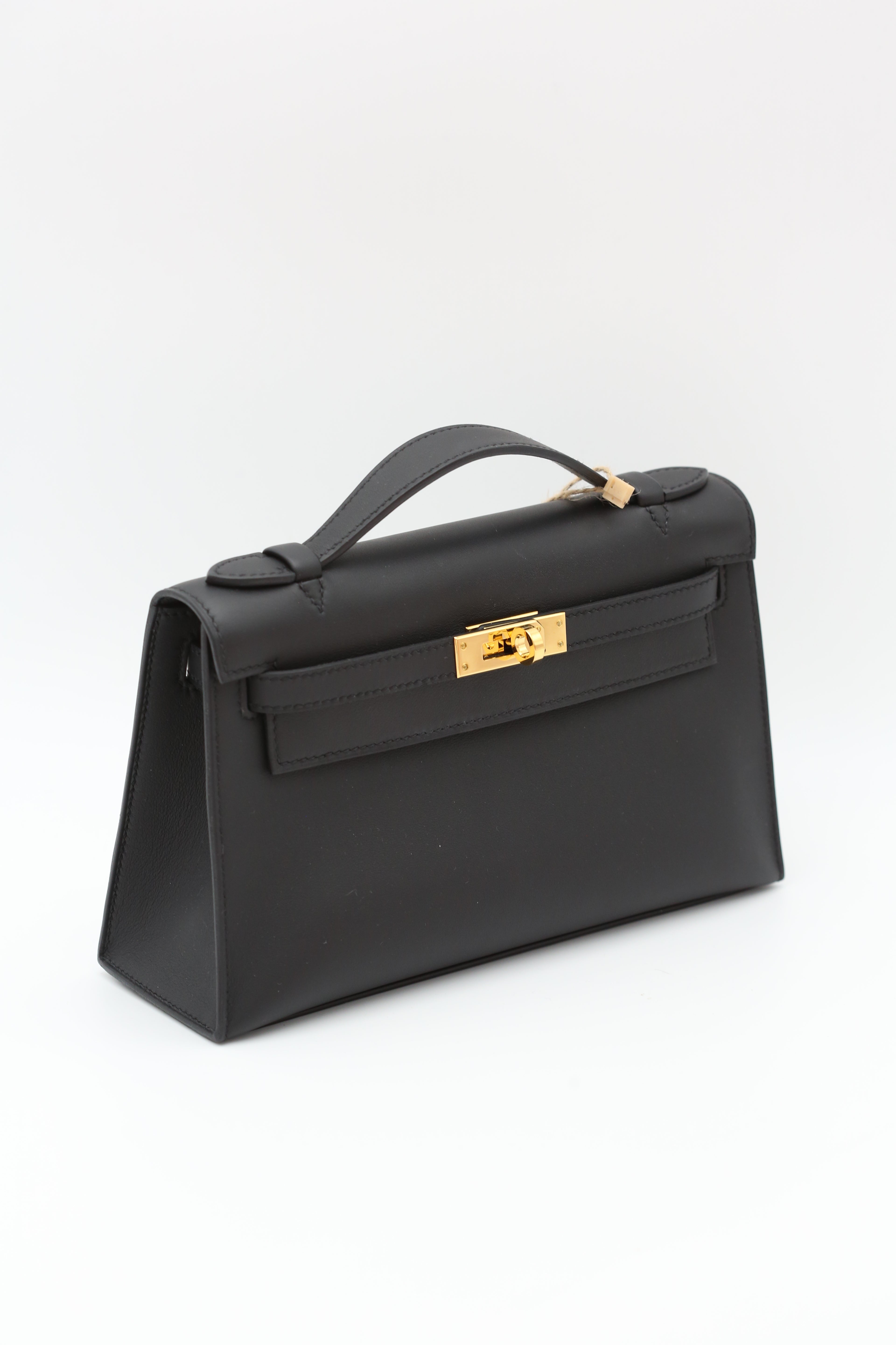 HERMÈS KELLY POCHETTE NOIR SWIFT K STAMP