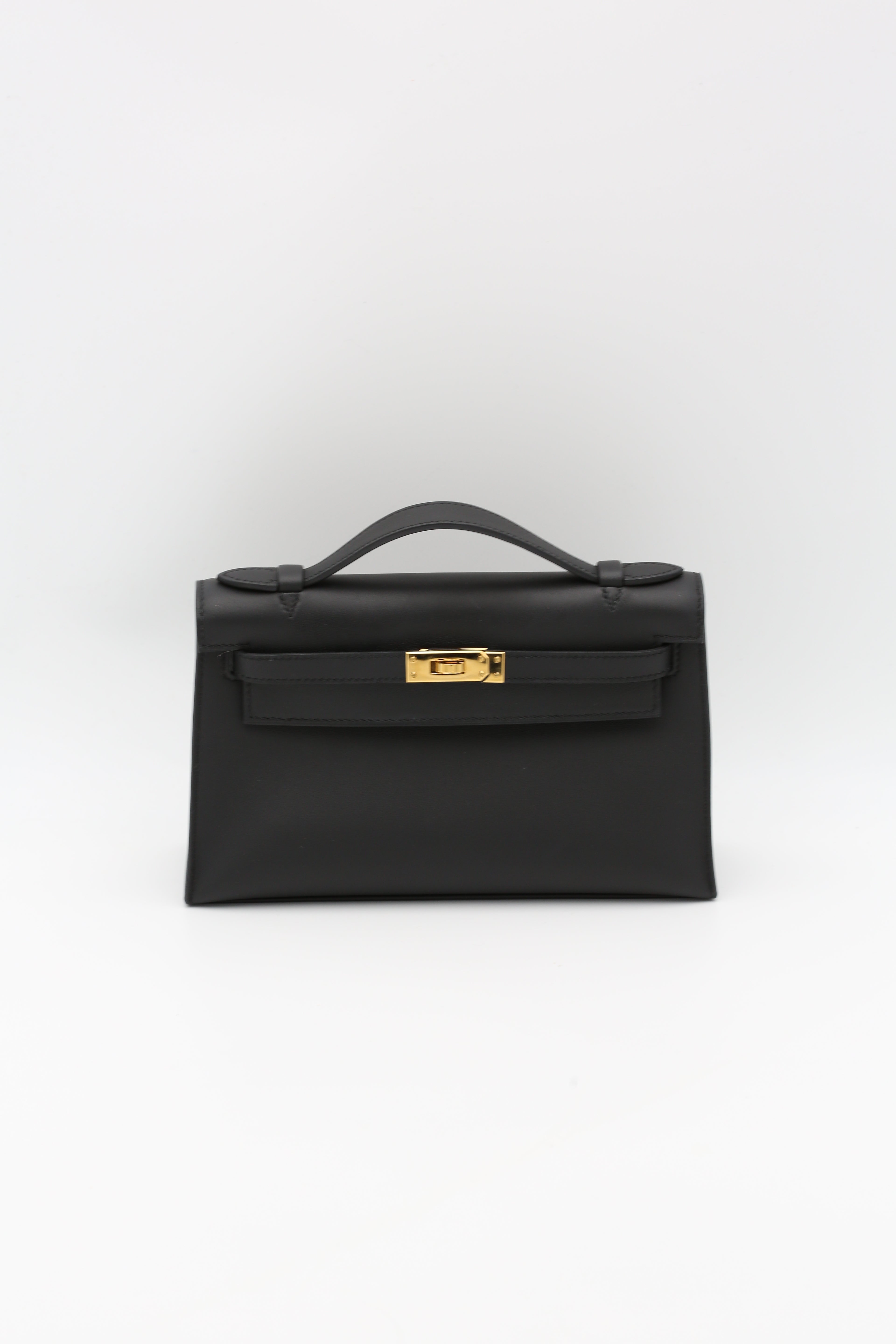 HERMÈS KELLY POCHETTE NOIR SWIFT GOLD HARDWARE K STAMP