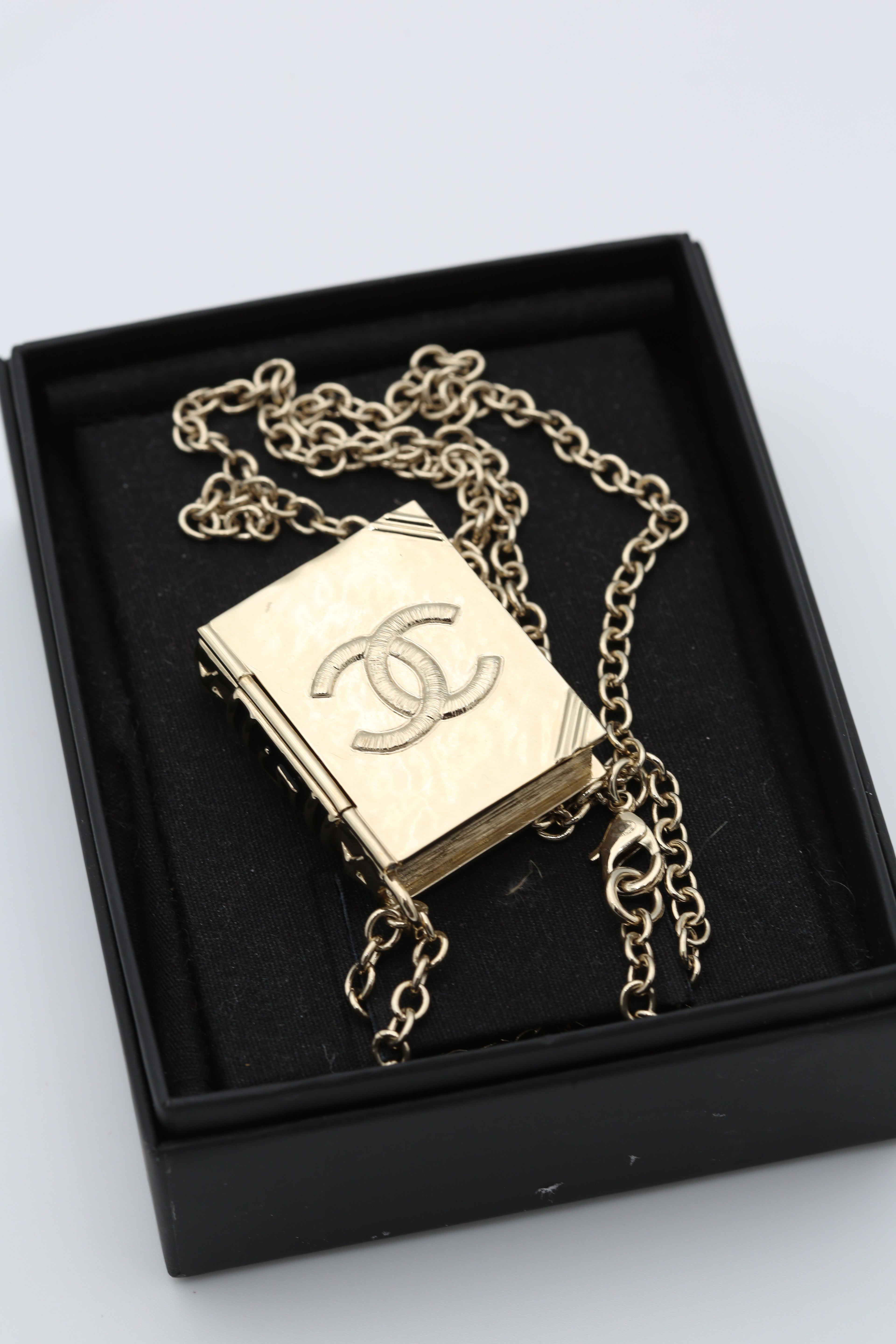 CHANEL BOOK NECKLACE GOLD