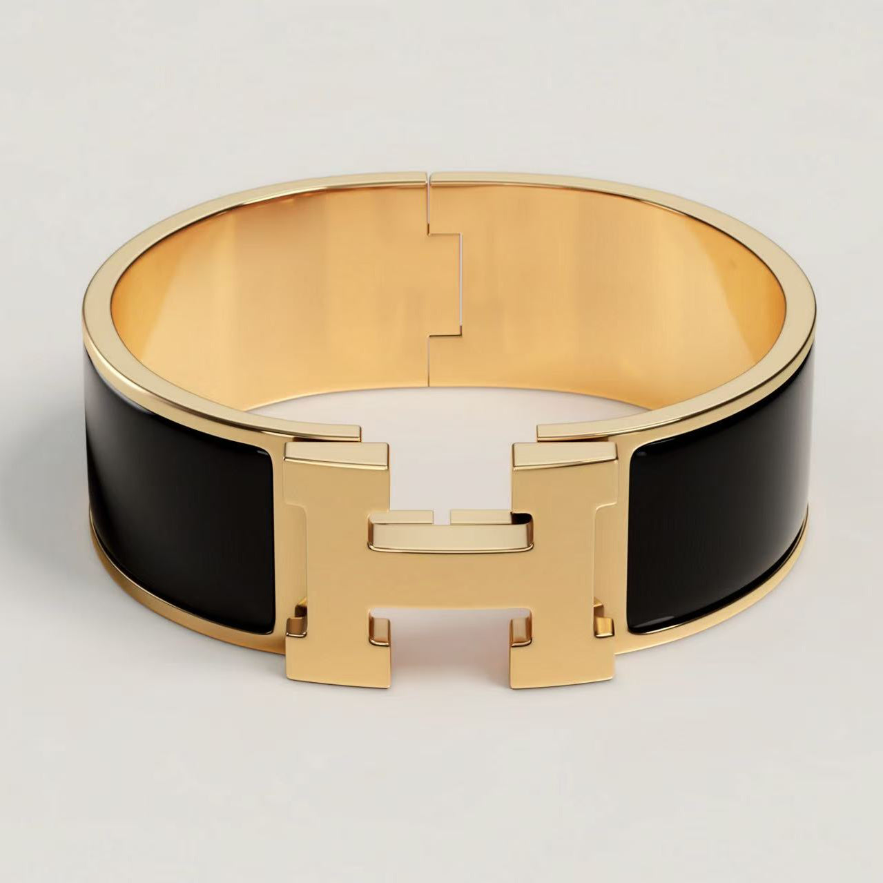 HERMÈS CLIC CLAC H BRACELET BLACK YELLOW GOLD