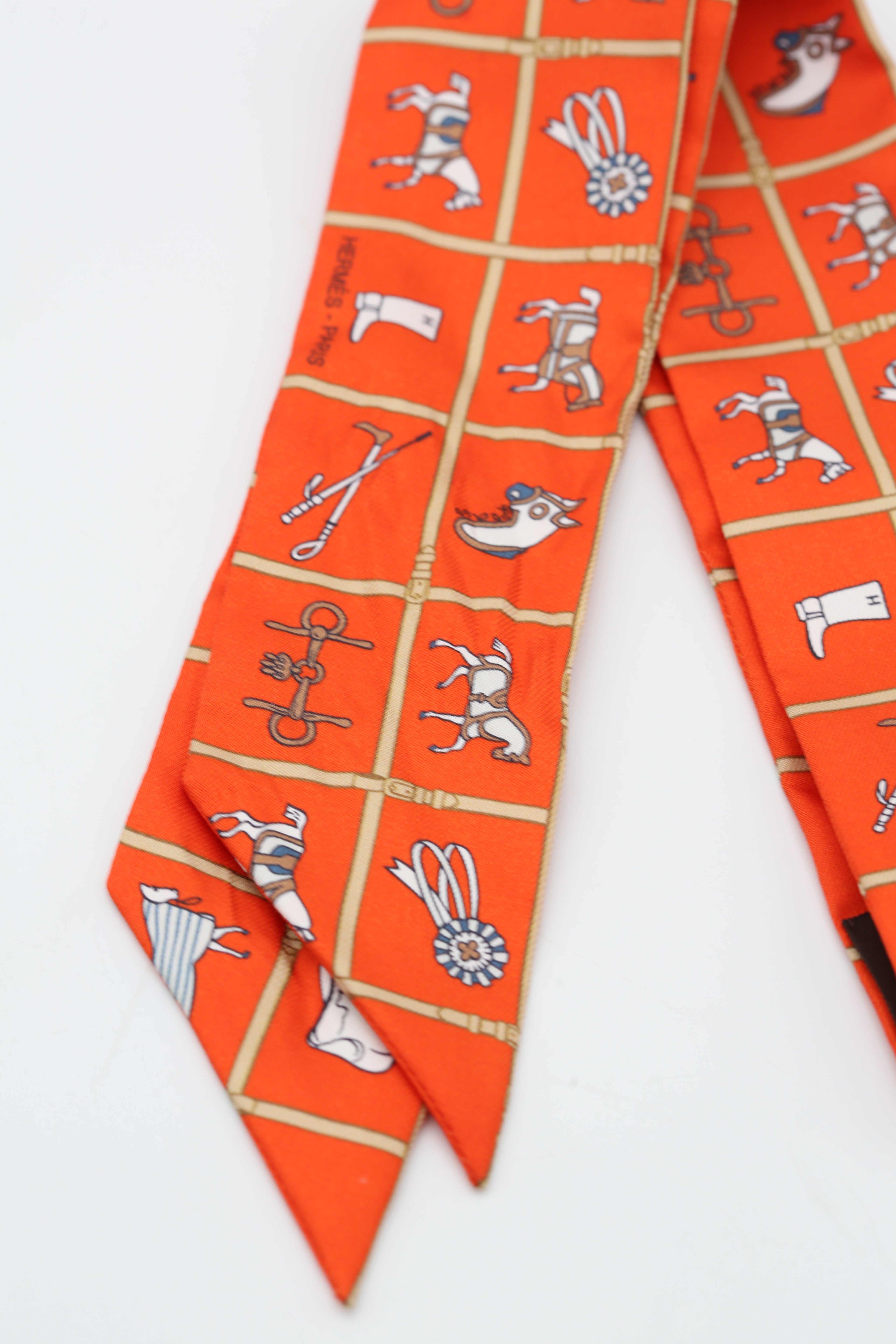 HERMÈS TWILLY ORANGE/MULTICOLOR