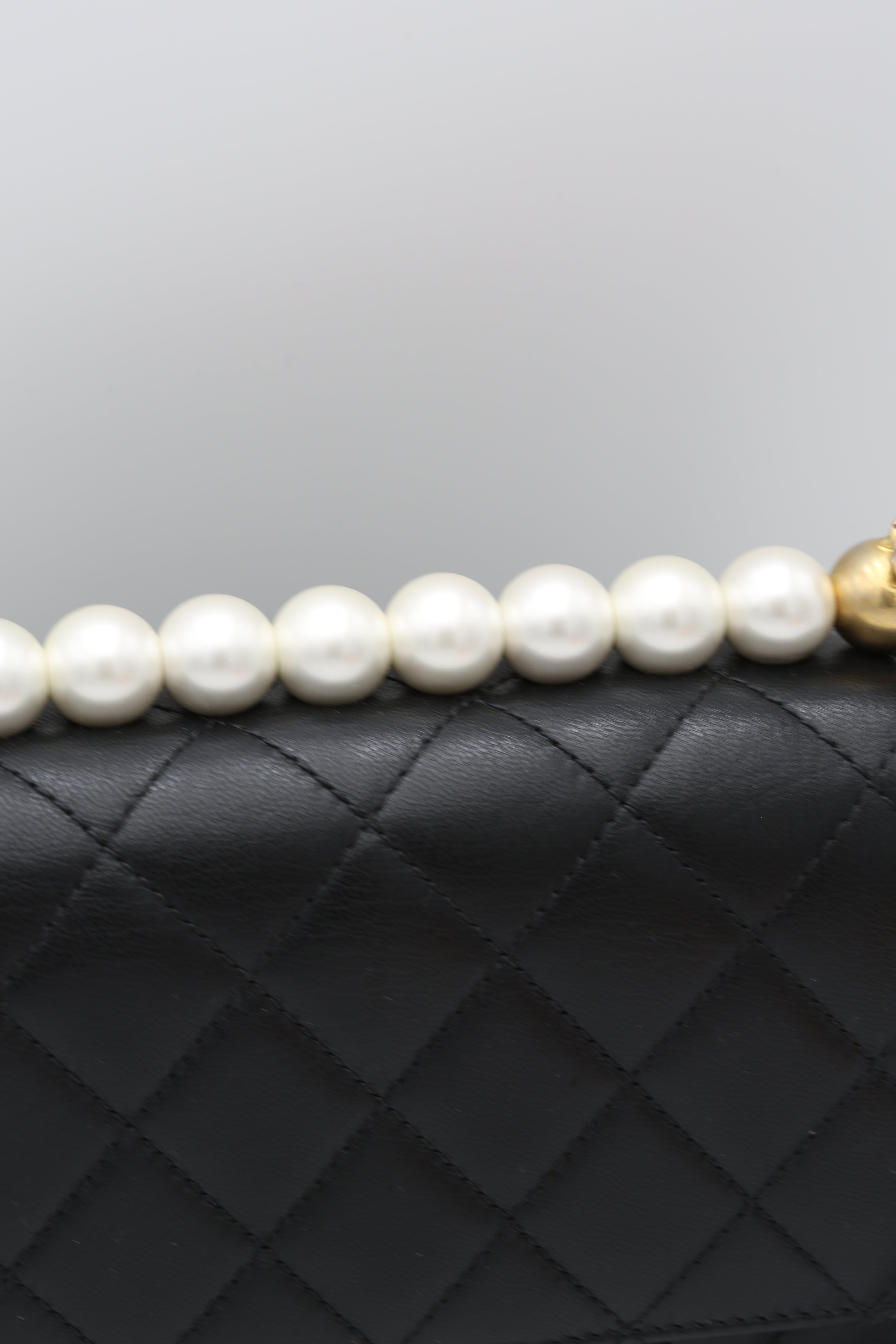CHANEL BLACK QUILTED MINI BAG WITH PEARL HANDLE
