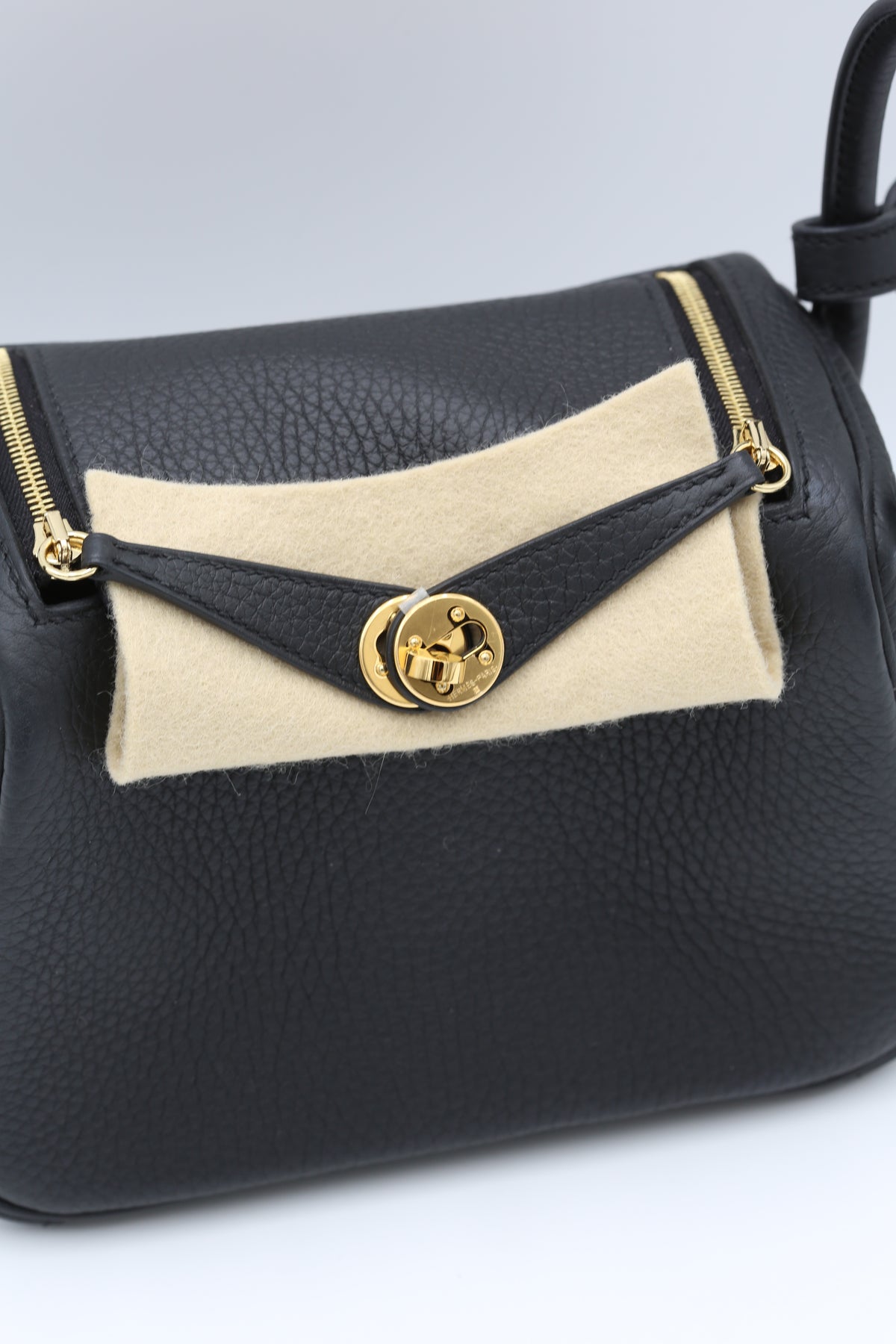 HERMÈS MINI LINDY NOIR TAURILLON CLEMENCE GOLD HARDWARE K STAMP