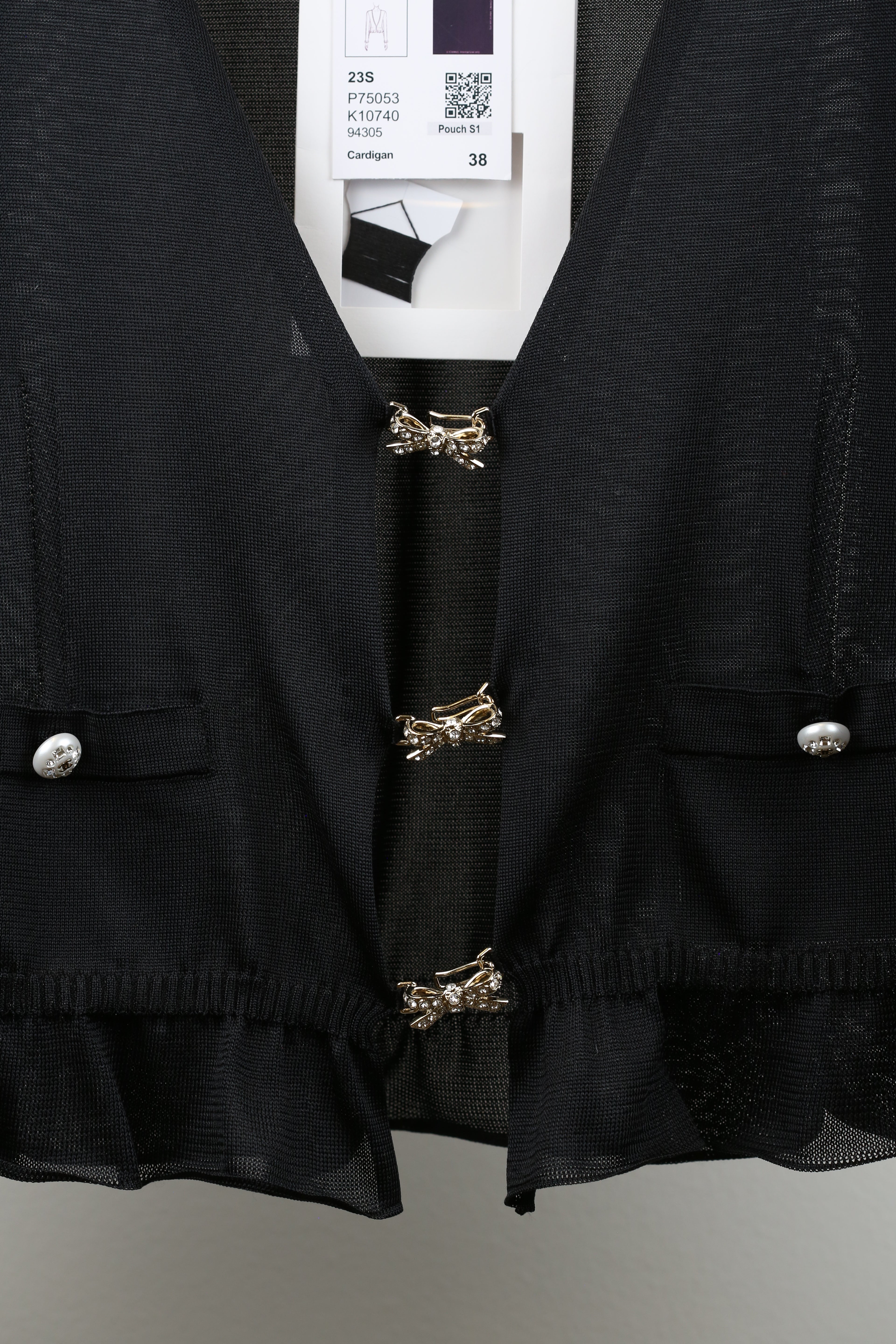 Cardigan with butterfly clasp