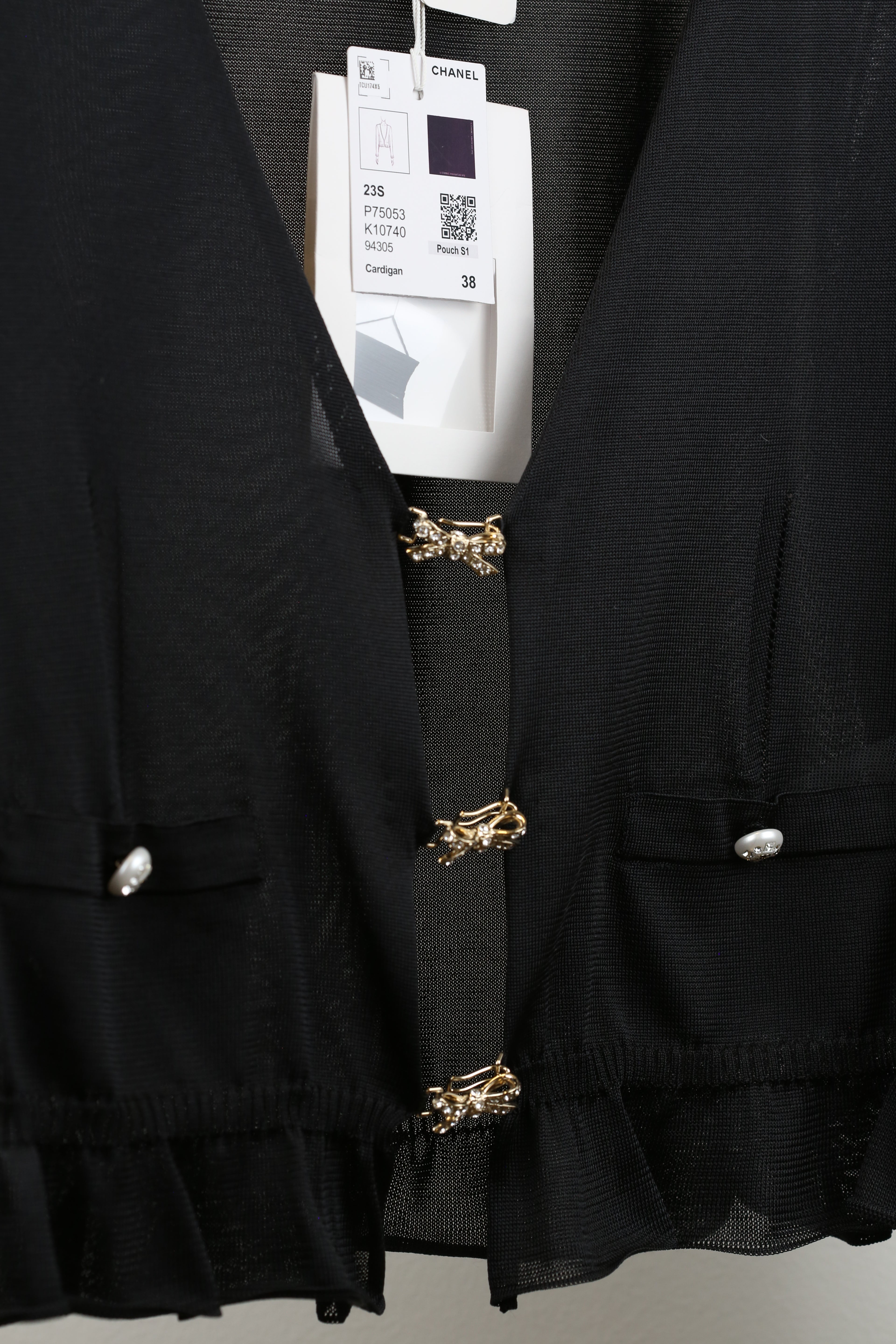 Cardigan with butterfly clasp