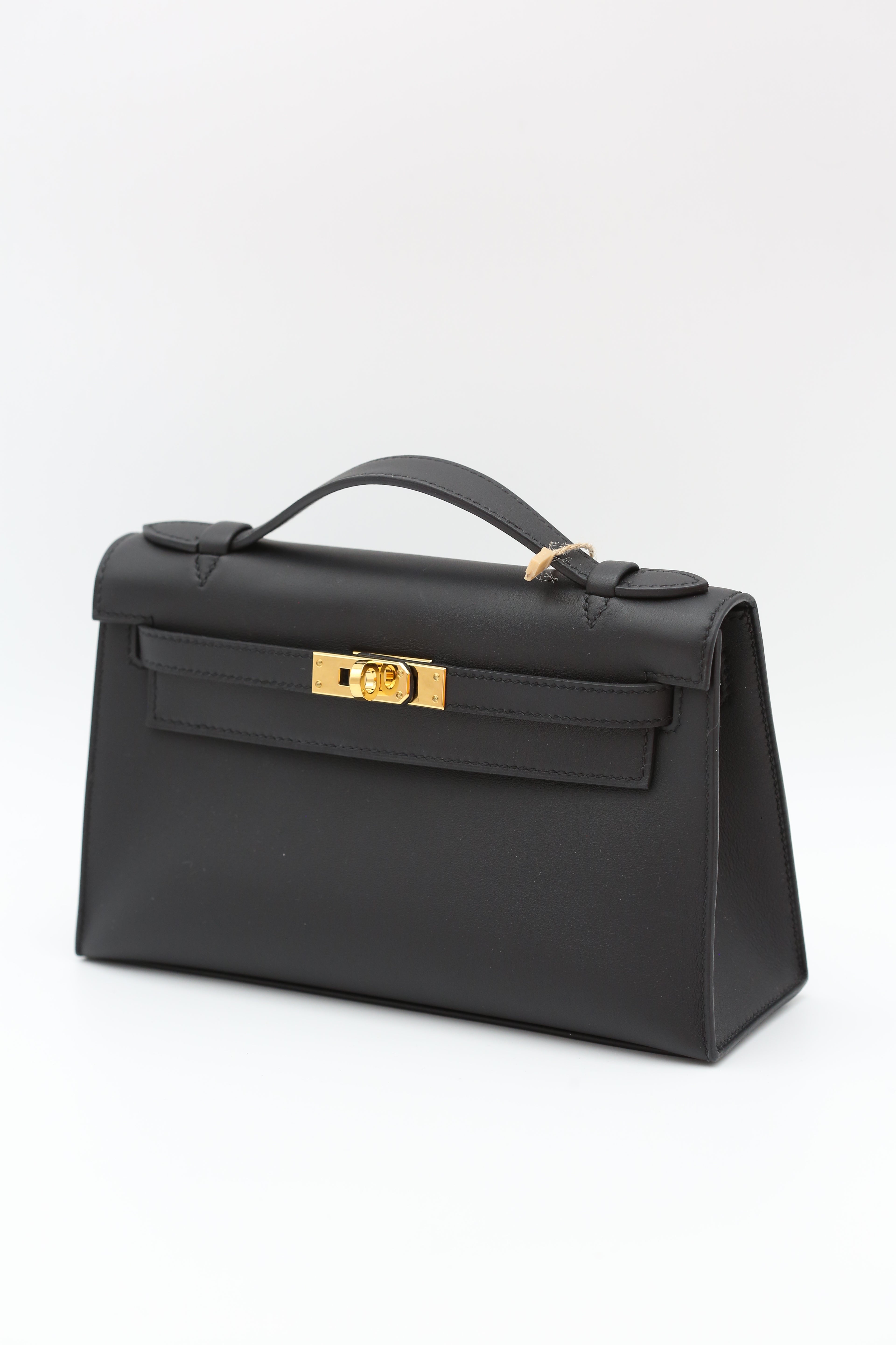 HERMÈS KELLY POCHETTE NOIR SWIFT K STAMP
