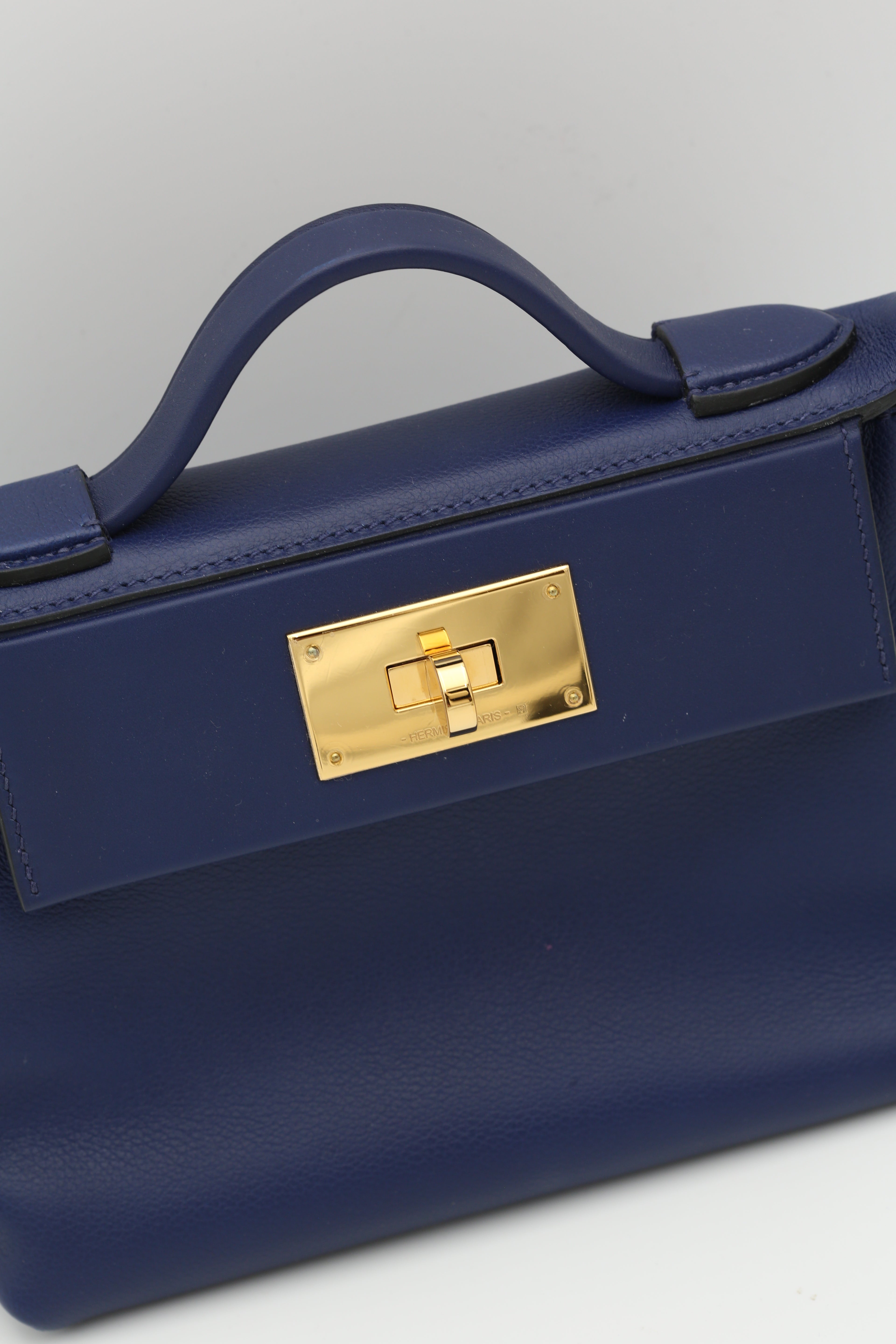 HERMÈS MINI2424 BLEU SAPHIR EVERCOLOR GOLD HARDWARE U STAMP