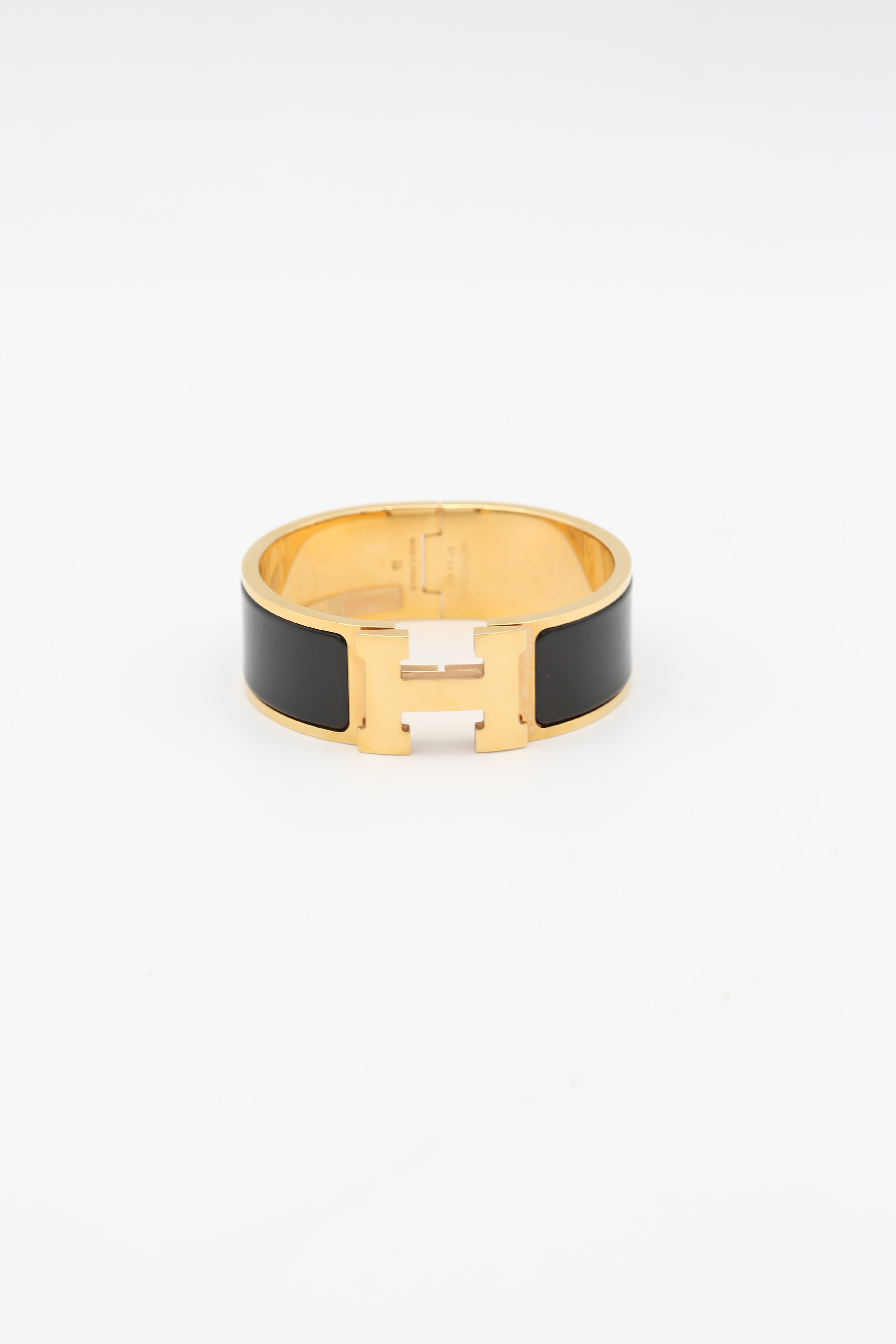 HERMÈS CLIC CLAC H BRACELET BLACK YELLOW GOLD